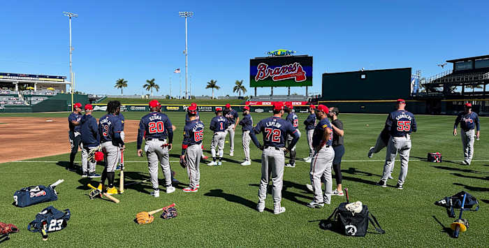 Atlanta Braves gather on the field before starting their spring training workout on Tuesday, Feb. 20, 2024 at CoolToday Park in North Port, Florida.  